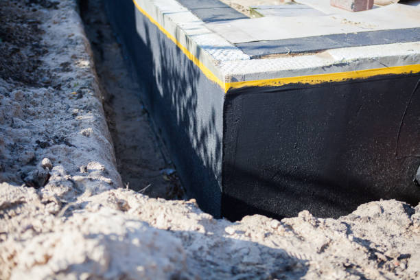 Professional Waterproofing technician working in Newton, AL